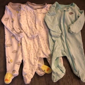Three newborn footie pajamas